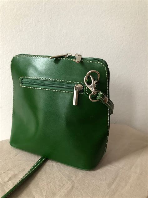 green leather crossbody purse.